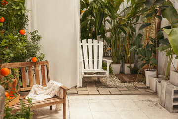 Vintage garden with wooden bench and white chair - obrazy, fototapety, plakaty