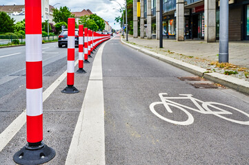 Separated bike lane on a main street in Berlin to improve road safety at the expense of parking...