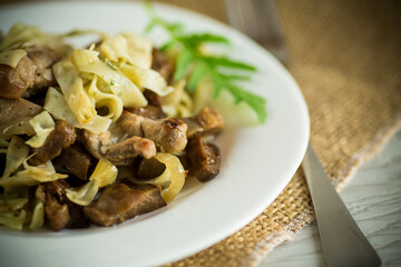 Homemade boiled noodles with meat and eggplant in a plate