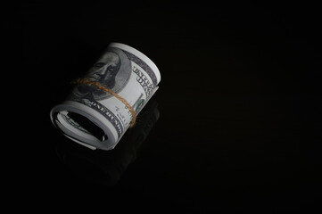 Money banknotes isolated on a black background. Copy space for the text