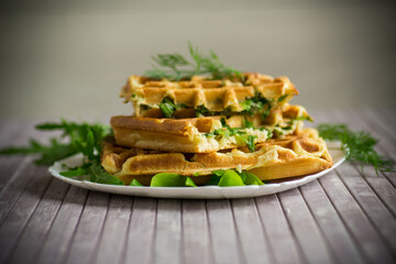 Homemade fried vegetable waffles with herbs inside