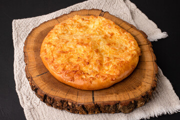 Khachapuri, khachapuri on a black background, Georgian cuisine