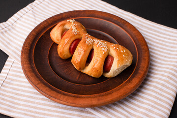 Sausage in dough, sausage in dough on a black background, Georgian cuisine