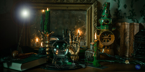Illustration of magical stuff....candle light, Chrystal ball, magic wand, book of spells dark...