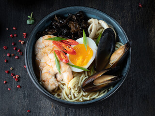 Close up noodles ramen in spicy soup with shrimps and prawns .Tom Yum Kung. Asian food style