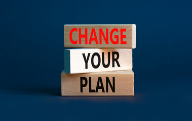 Change your plan symbol. Concept words Change your plan on wooden blocks on a beautiful grey table grey background. Business, finacial and change your plan concept. Copy space.