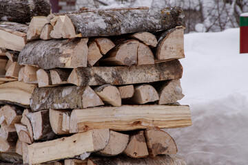 harvesting wood in winter for home heating
