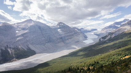 Beautiful pristine alpine valley surrounded by mountains and with glacier on its end, Jasper, Canada