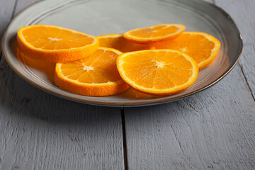 circular slice of oranges on a plate