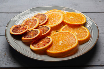Obraz na płótnie Canvas circular slice of oranges on a plate