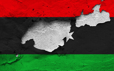 Graphic Concept of a damaged Flag of Libya painted on a wall.