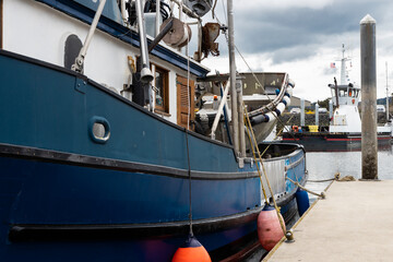 Blue commercial fishing boat at dock