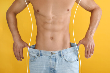 Closeup view of man with slim body in oversized jeans on yellow background. Weight loss