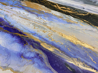 Abstract textured purple art with gold and blue — violet background, beautiful smudges, stains, stokes and smears made with alcohol ink and acrylic. Gold wall art texture resembles oil painting