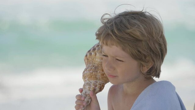portrait of a blond child with blue eyes hearing shell song, blue sea, innocence and purity