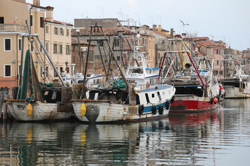 many moored fishing boats on the navigable canal