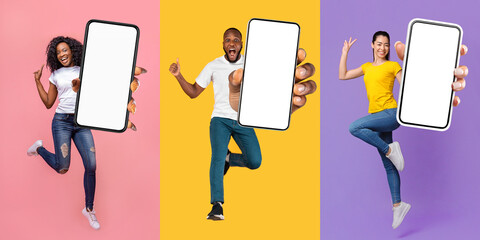 Emotional multiethnic millennials jumping up with smartphones and gesturing, mockup