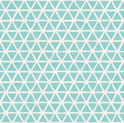 Seamless pattern of drawn turquoise triangles on a light background. For fabric, sketchbook, wallpaper, wrapping paper.