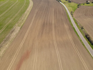 Top view of plowed field on a sunny day in spring 