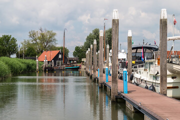 Small marina at the historic harbor along the river Waal in the Dutch town of Woudrichem.