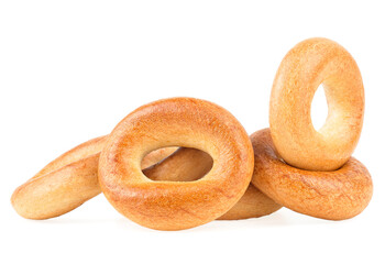 Delicious bread rings isolated on a white background. Pile of fresh bagels.