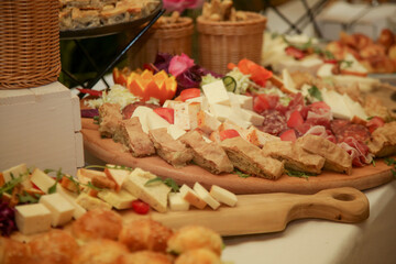 Buffet-style served meal with multiple hot and cold dishes of various foods on a table, directly above. Swedish table.