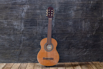 Fototapeta na wymiar Acoustic guitar in a rustic wooden setting 