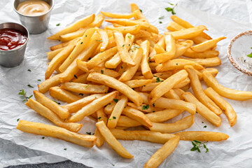 Traditional french fries with ketchup and honey mustard sauce