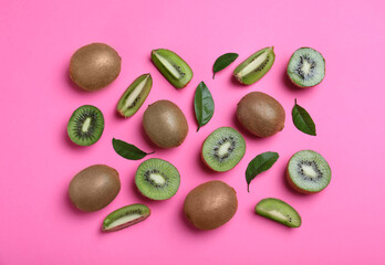 Flat lay composition with fresh ripe kiwis on pink background