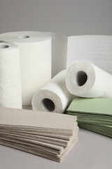 Paper towels and napkins on grey background