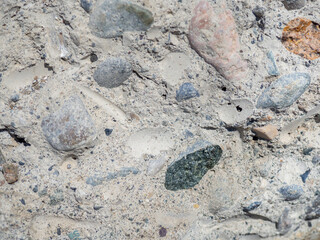 Texture of broken concrete. Stone block. Frozen stone mix. Gray cement