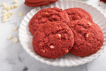Red velvet cookies with white chocolate chips with milk
