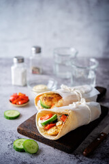 Pita bread with roasted chicken, red bell pepper and cucumber