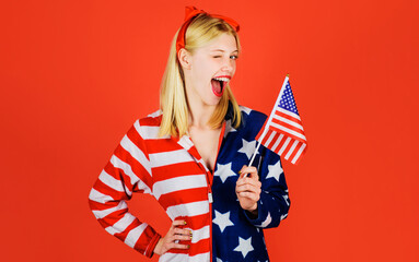 Independence Day celebration. July 4th. Winking girl with American flag. National colors USA.