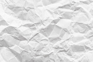Texture of crumpled white paper. Background of light paper with bends and scuffs