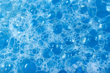 ckground of dusty foam with bubbles of blue color for an inscription. Soap sud with copy-space