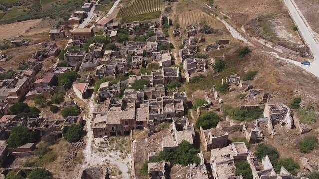 Aerial drone view of the ruins of Poggioreale on the Belice valley, in the province of Trapani. The town was destroyed by and earthquake in 1968. Abandoned empty eerie ghost town in Sicily.