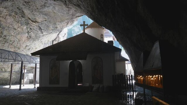 Church in cave, pestera monastery, Romania, faith everywhere, light in darck, candles burning