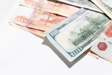 rubles lying on american dollars as a symbol of weakness russian national currency and strengthening of american dollar.financing of war and aggressive actions, no war and catastrophes.copy space