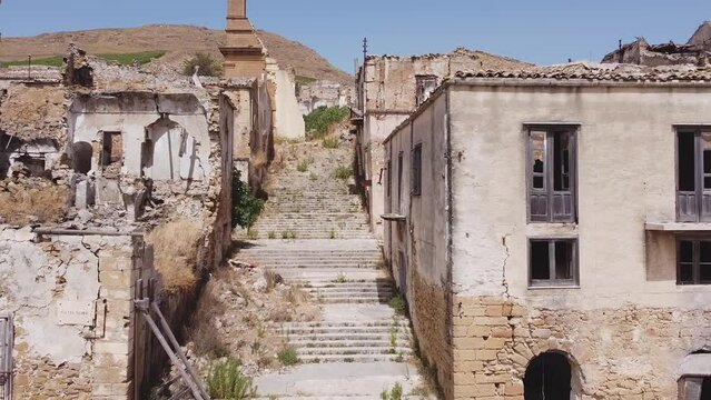 Aerial drone view of the ruins of Poggioreale on the Belice valley, in the province of Trapani. The town was destroyed by and earthquake in 1968. Abandoned empty eerie ghost town in Sicily.