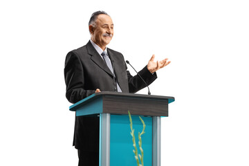 Politician giving a speech on a podium and smiling