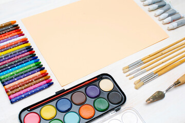 Watercolor oil paints, paintbrushes, colorful pencils, pastel crayons,blank watercolor paper pad....