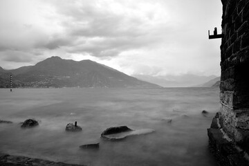 Long exposure on Como lake in a cloudy day - 508120172