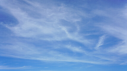 WIspy clouds and blue sky suitable for background use or sky substitution