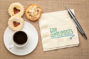 give compliments inspirational reminder or advice, handwriting on napkin with coffee and cookies, kindness, positivity  and personal development concept - obrazy, fototapety, plakaty