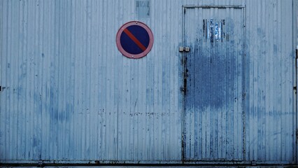 industrial metal door with no parking sign