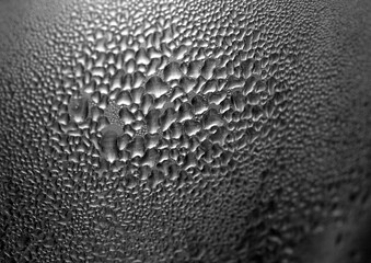 Macro background with water droplets condensation pattern on metal surface 