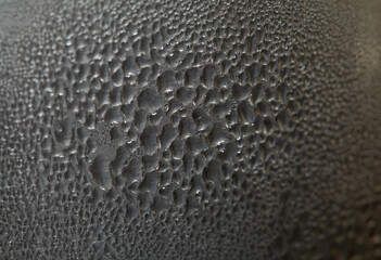 Macro background with water droplets condensation pattern on metal surface 
