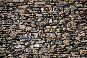 Dry stone stone wall background with copy space