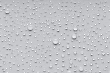The surface is covered with round drops of water of different sizes.
